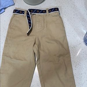 Beige slacks with a blue belt